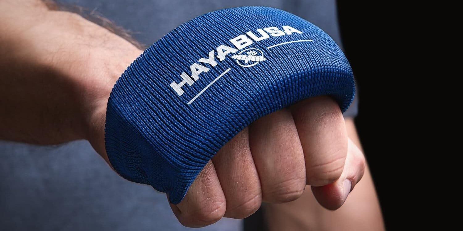 Close-up of a hand wearing a blue Hayabusa wrist wrap