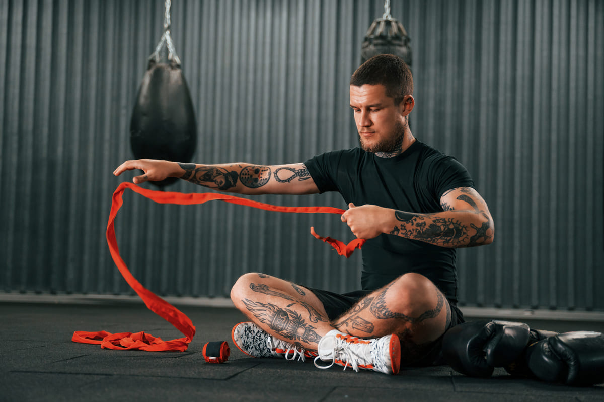 wearing hand wraps young tattooed man is practici 2022 07 27 22 22 59 utc